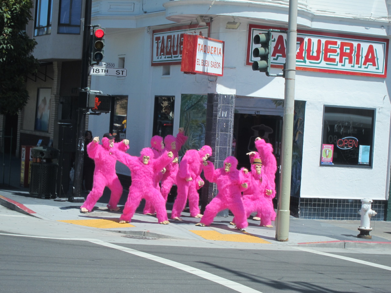 Gaggle of Pink Gorillas Bustin' Moves on Valencia Uptown Almanac